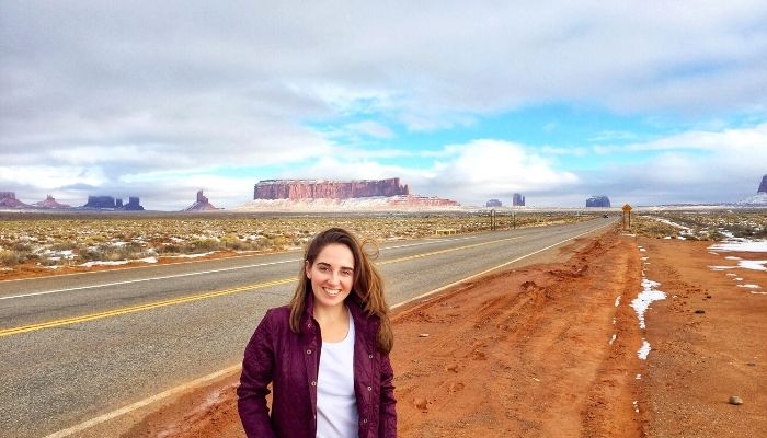 charlotte standing in front of monument valley in utah