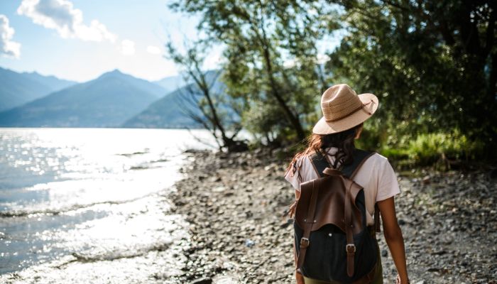 a woman exploring a lake